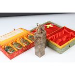 A cased set of four Chinese reverse painted glass snuff bottles together with a pair of cased