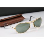 A pair of vintage aviator style sunglasses complete with case.