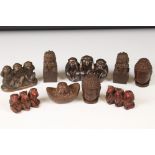 A small collection of ornamental figures to include the three wise monkeys, foo dogs and Buddha