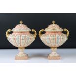 Pair of German porcelain ' Rudolstadt ' Urns and Covers, decorated with panels of gilt and floral