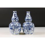 Pair of Chinese porcelain Blue and White Double Gourd Vases decorated with dragons amongst