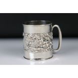 Edwardian Silver Christening Tankard with a band of scrolled repousse decoration featuring cherubs