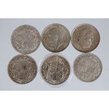 A collection of six King George V silver half crown coins to include 1916, 1917, 1916, 1915, 1917
