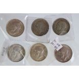 A collection of six King George V silver half crown coins to include 1916, 1915, 1918, 1912, 1915