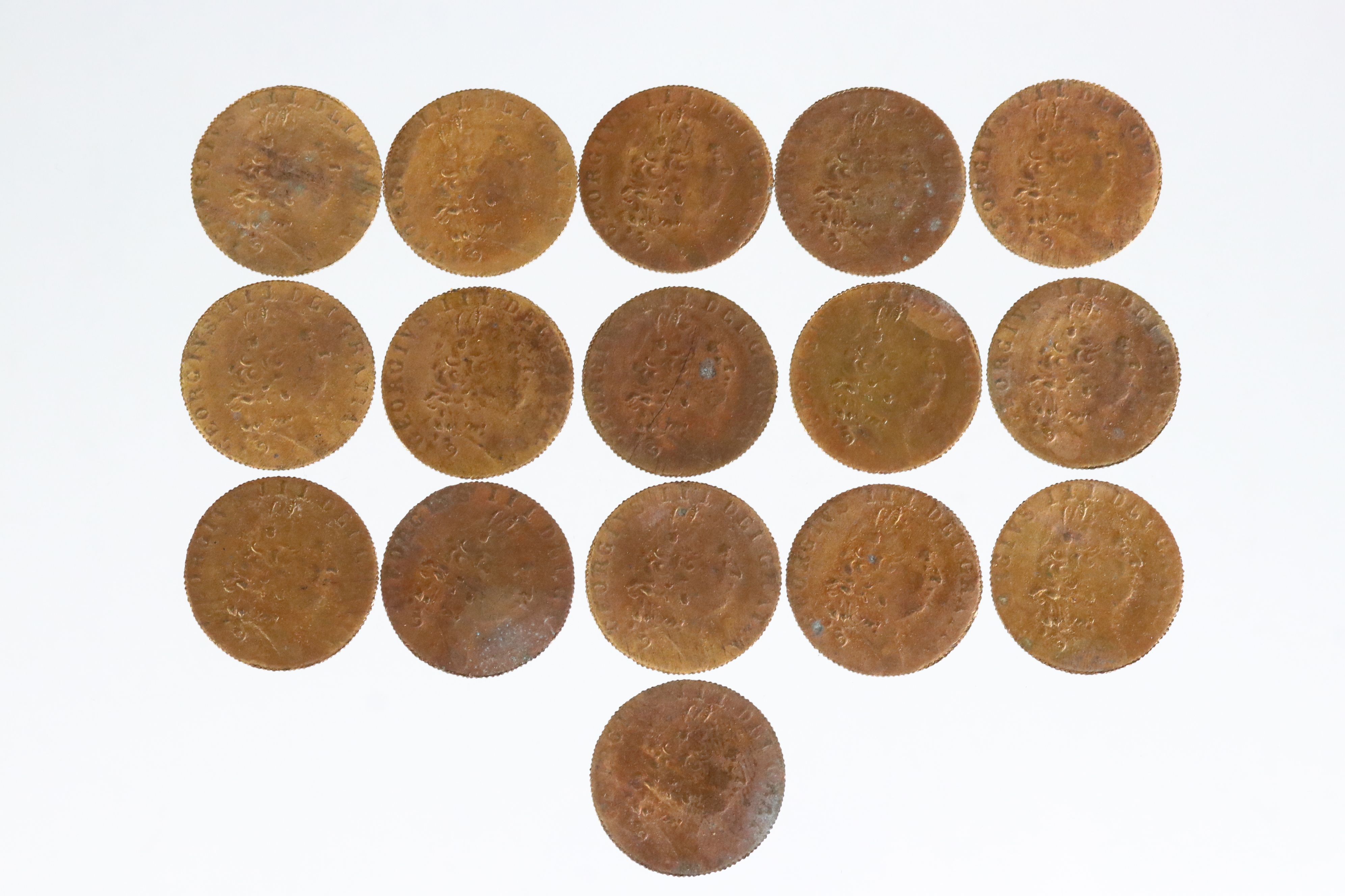 A collection of approx fifteen King George III spade guinea style gaming tokens.