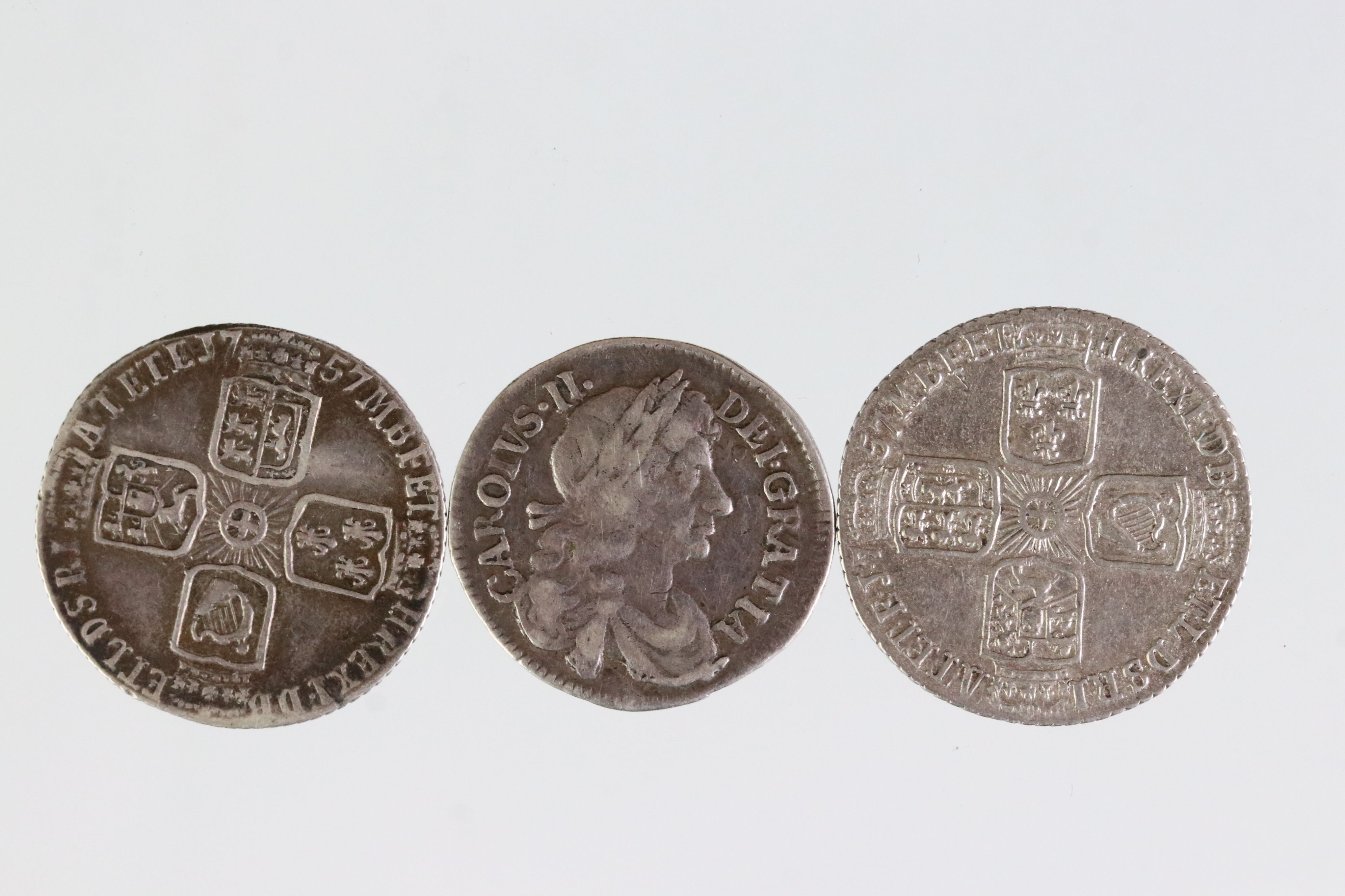 Three early milled British silver coins to include a King Charles II sixpence dated 1679 and two - Image 2 of 3