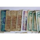 A collection of approx fifty foreign banknotes to include British Military examples.