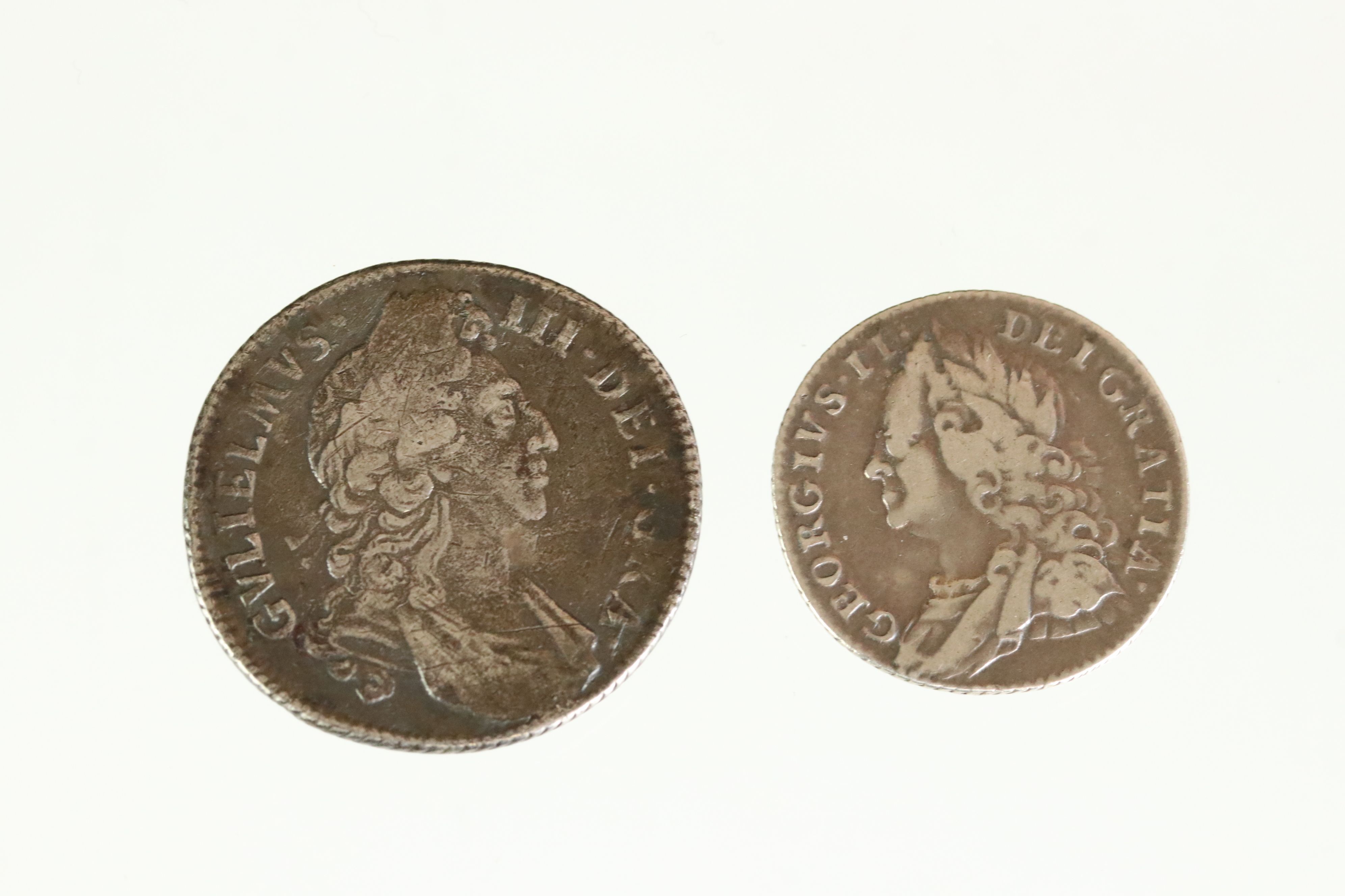 Two British early milled silver coins to include a King George II silver sixpence together with a