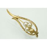 Mikimoto pearl 14ct yellow gold spray brooch, three spherical white pearls with pink and grey