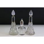 Pair of George V silver collared conical cut glass scent bottles with star-cut bases, with flame-