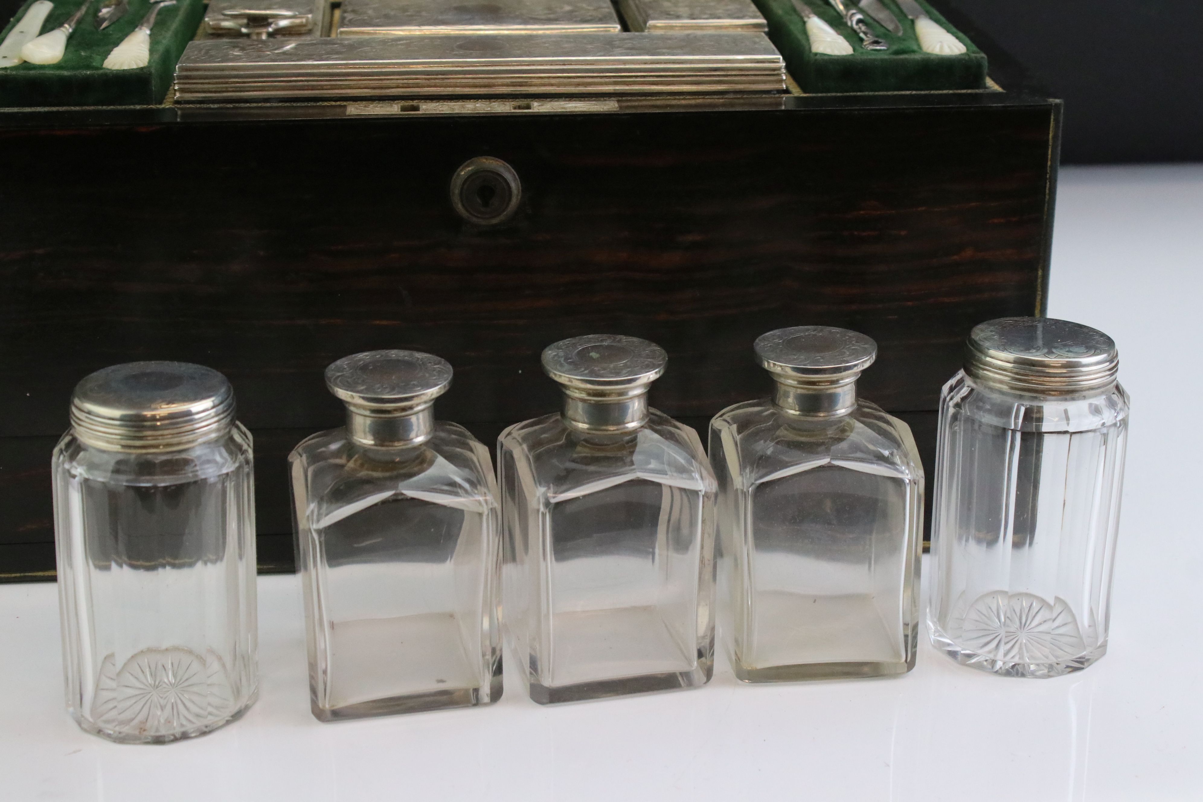 Mid 19th century coromandel travelling dressing box, containing silver topped dressing table jars, - Image 10 of 13