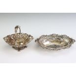 Edwardian silver bon bon dish of ovoid form, with pierced borders, embossed scrolling decoration,