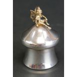 Silver parcel gilt Tooth Fairy trinket pot, the gilt fairy sat atop a mushroom, plastic lined,