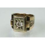 Diamond solitaire unmarked yellow gold Gents signet ring, the round brilliant cut diamond weighing