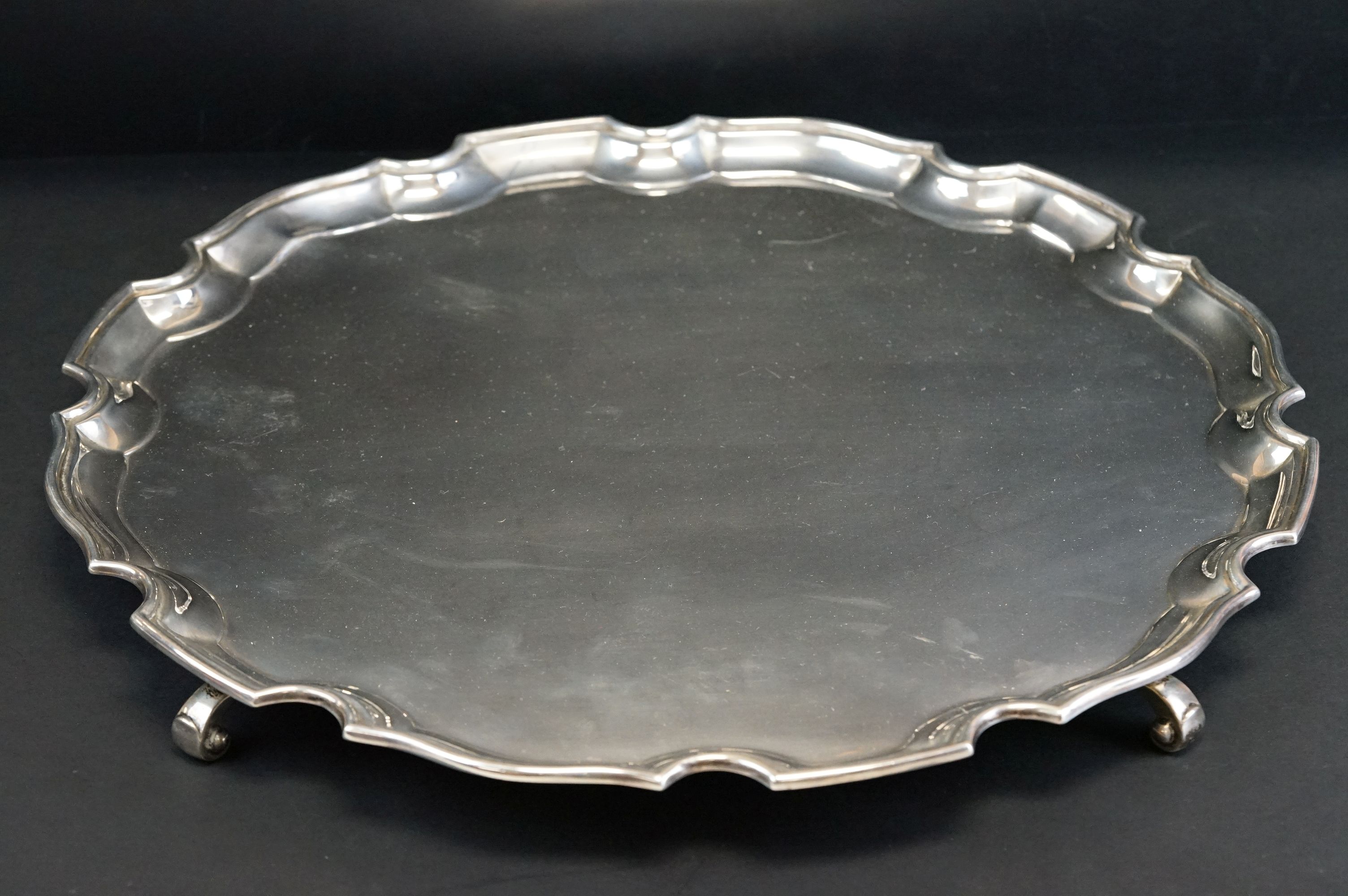 Silver salver raised on four scroll feet, plain polished, Chippendale style border, makers Adie - Image 2 of 11
