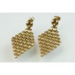 Pair of 9ct yellow gold drop earrings, the lozenge formed of brick-link style framework, post and