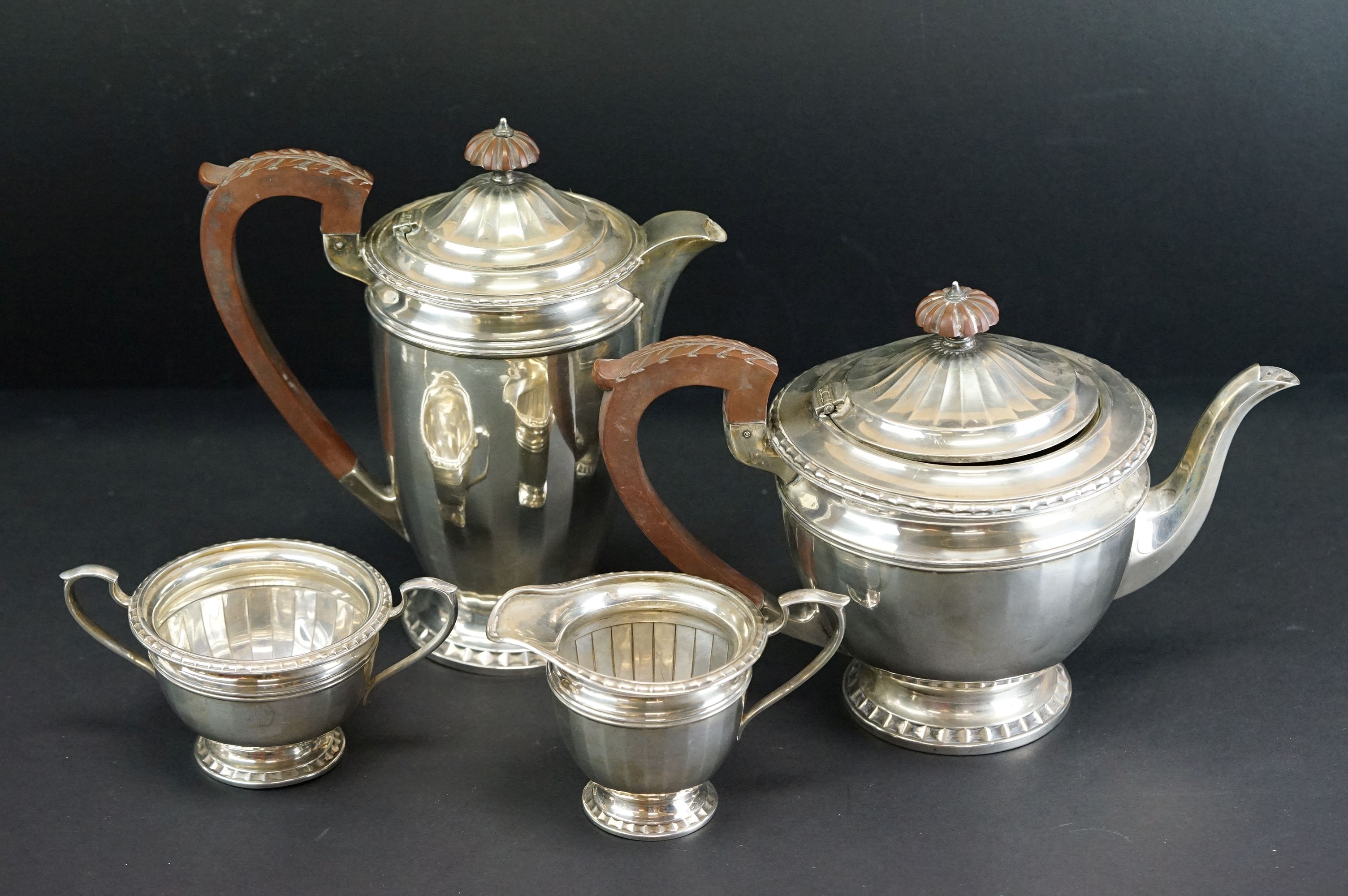 Barker Brothers 1930s silver four piece tea service comprising a teapot, hot water pot, twin-handled