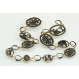 19th century cast bronzed metal necklace with yellow and rose metal mounts, the necklace formed of