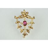 Edwardian tourmaline and seed pearl unmarked yellow gold pendant, the oval mixed cut pink tourmaline