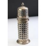 Edwardian silver sugar caster of lighthouse form, pierced body, moulded foot, reeded writhen finial,