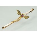 Edwardian ruby and seed pearl unmarked yellow and rose gold bar brooch, the dragonfly thorax