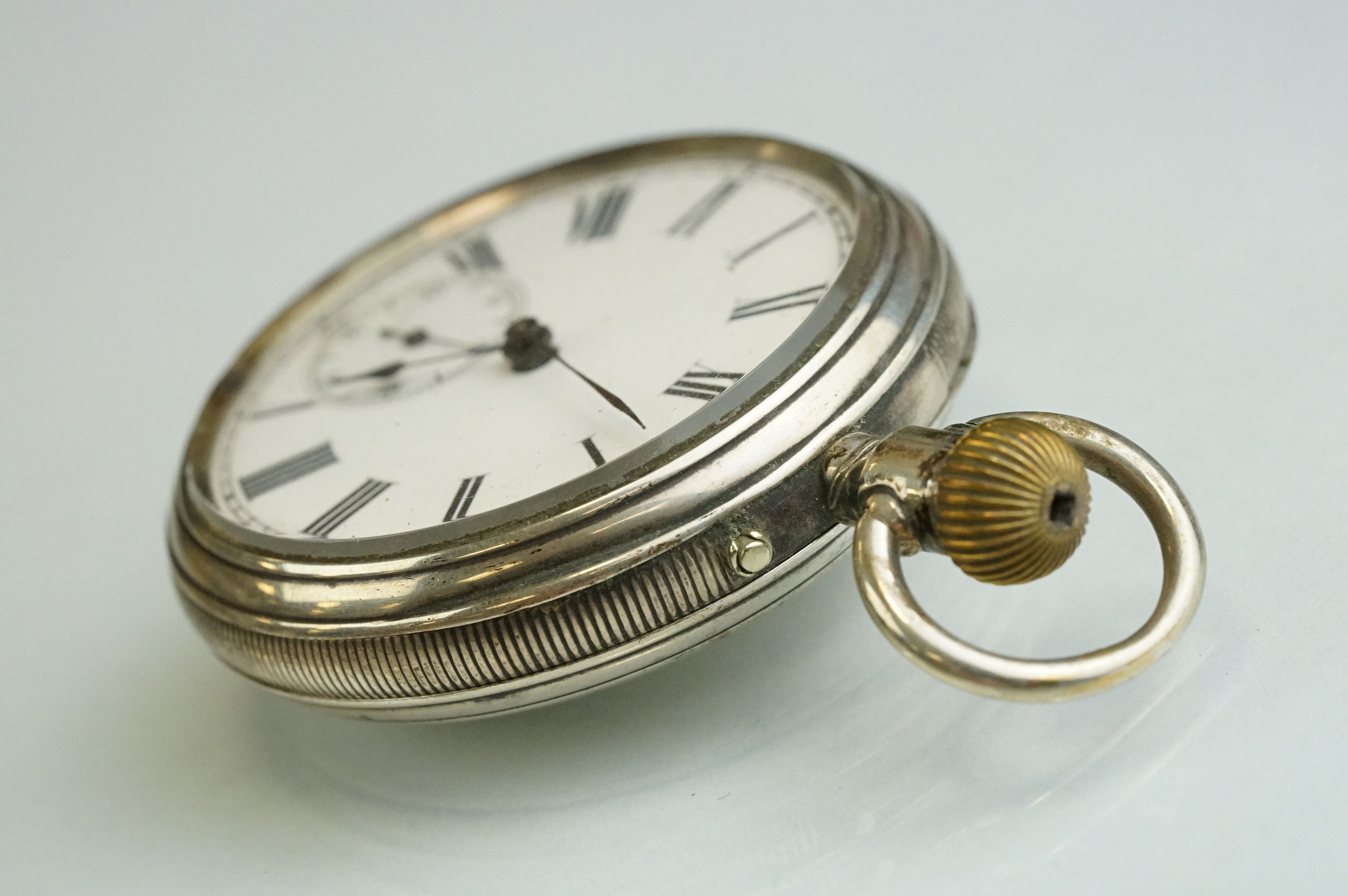 Silver open faced crown-wind pocket watch with black Roman numerals on a white enamel dial, - Image 4 of 8