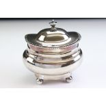 Edwardian silver sugar bowl of stepped polished form with hinged lid, gilt interior, crimped rim,