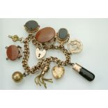 Late 19th / early 20th century 9ct rose gold curb link charm bracelet with 9ct gold padlock clasp