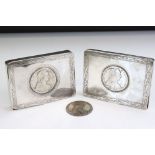 Two Continental white metal cigarette boxes with Maria Theresa coins inset to the hinged lids,
