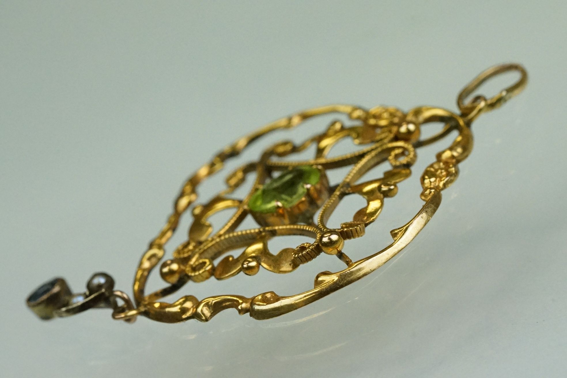 Edwardian peridot, zircon and seed pearl 9ct yellow gold pendant, the oval mixed cut peridot to - Image 3 of 8