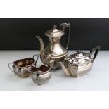Edwardian James Dixon & Sons three piece silver tea service comprising a teapot with ebonised