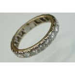 Diamond unmarked white gold full eternity ring, seventeen round brilliant cut diamonds, each