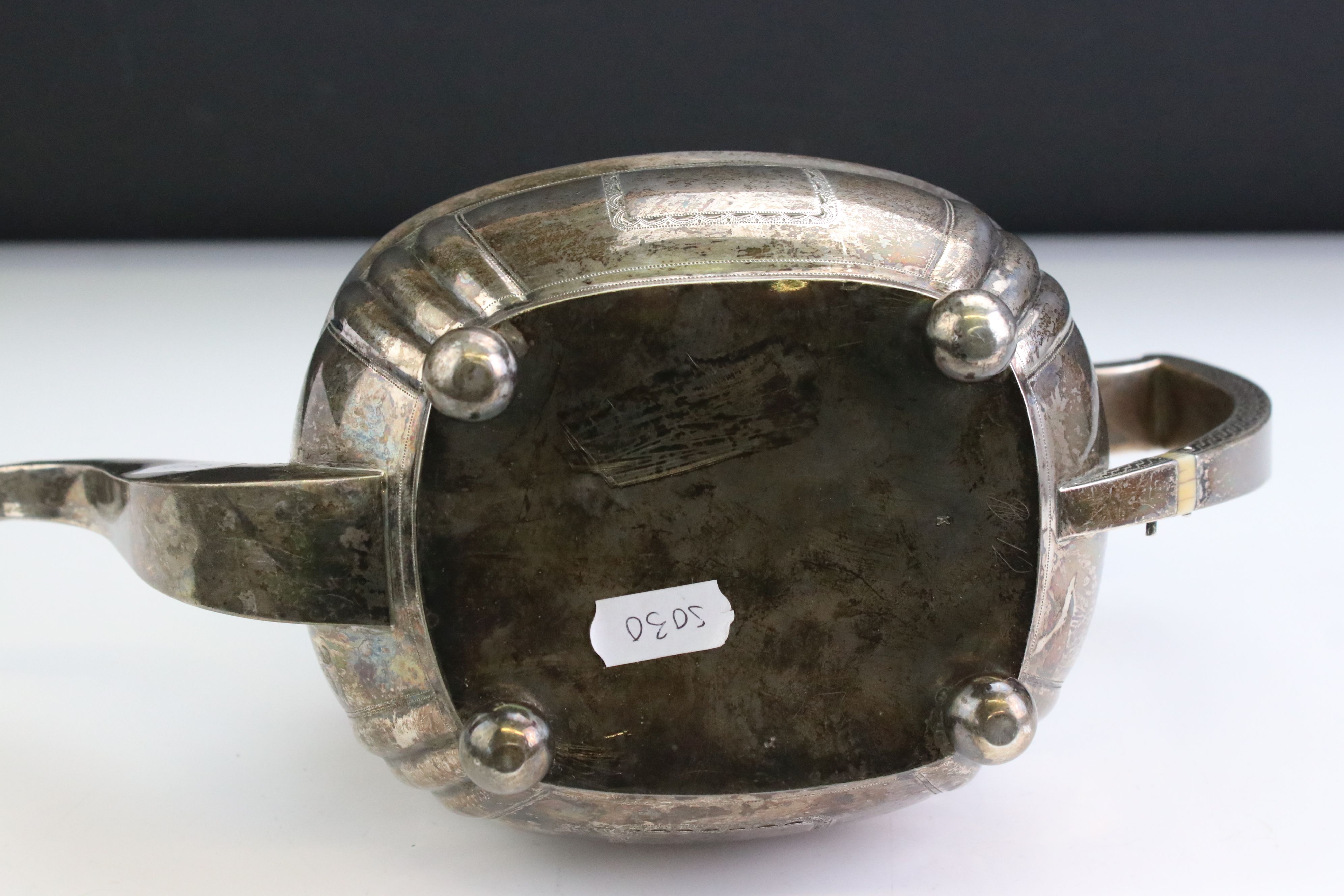 George III silver teapot raised on four ball feet, engraved floral and foliate decoration to the - Image 6 of 6