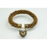 19th century mourning bracelet, the band formed or woven brown hair, gilt plated collar finials, the