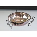 Edwardian James Deakin & Sons silver dish raised on three scrolling foliate feet, ribbed border