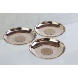 Set of three Hong Kong sterling silver circular pin dishes, each inset with 1975 two dollar Hong