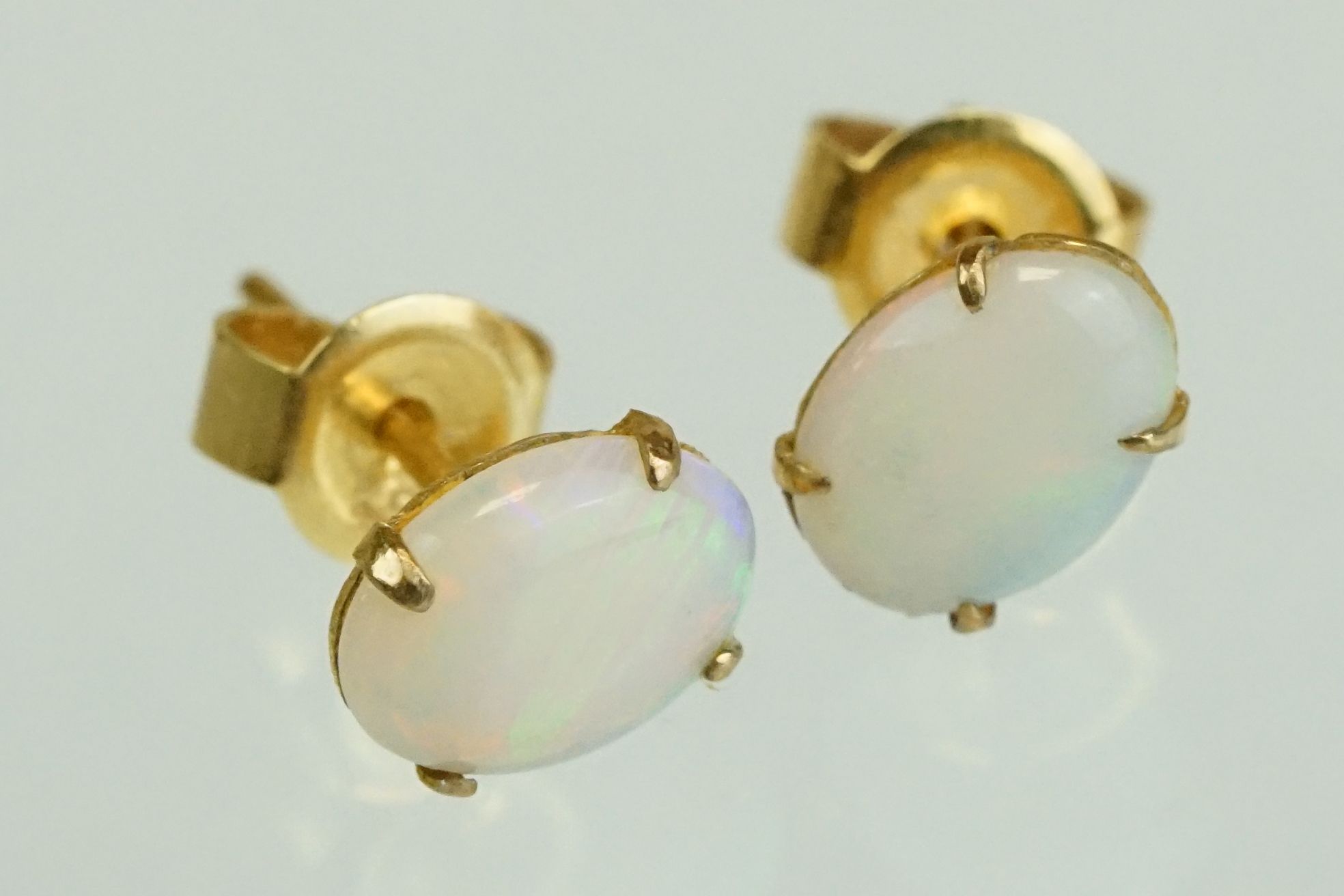 Pair of precious white opal 9ct yellow gold stud earrings, the opals displaying yellow, green, - Image 12 of 17