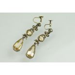 Pair of 19th century citrine, yellow topaz and marcasite unmarked silver drop earrings, the oval