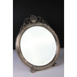 Edwardian silver dressing table mirror raised on two feet, reeded surround with crossover