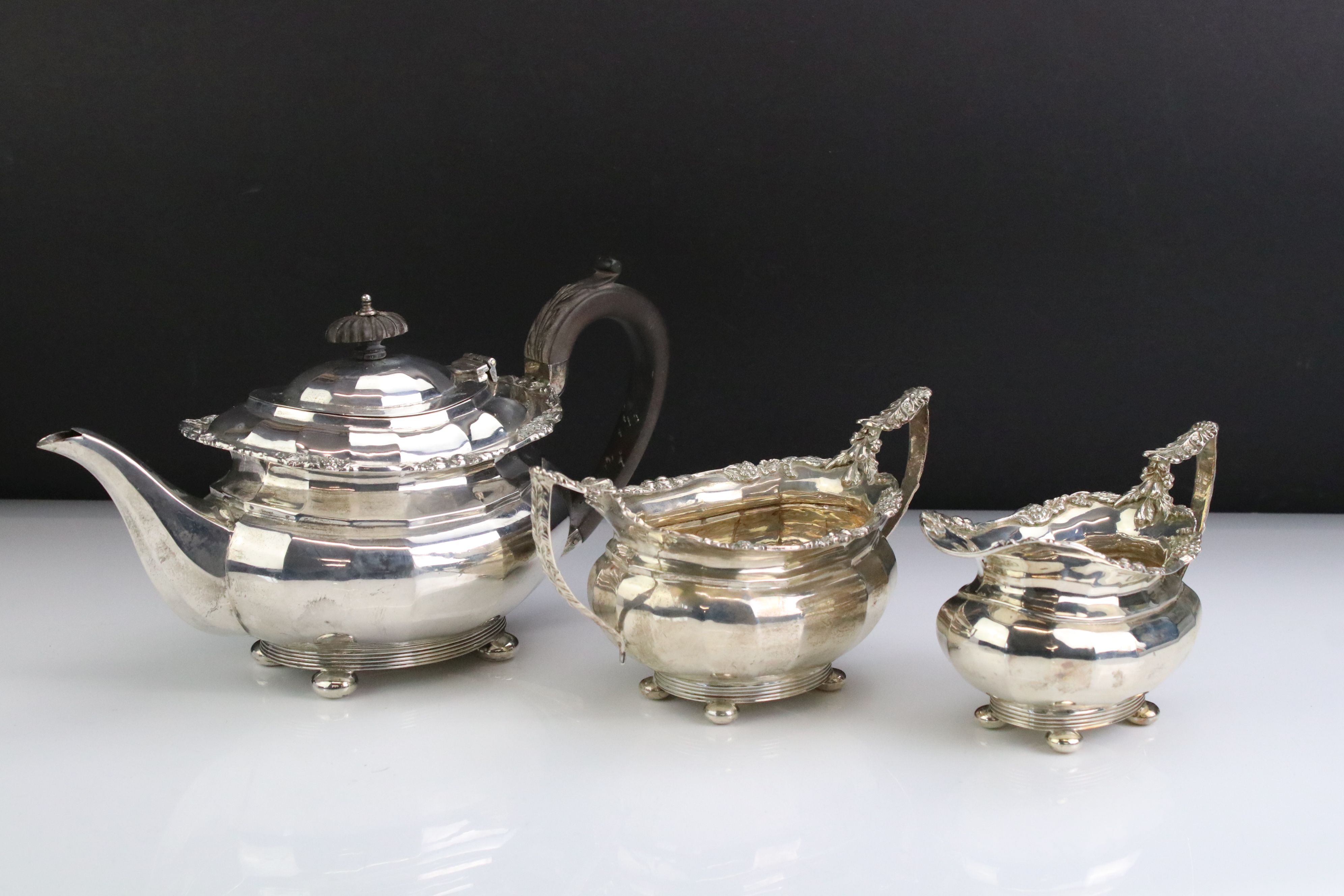 Three piece silver tea service, comprising teapot, milk jug and twin handled sugar bowl, the