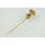 Grenadier Guards yellow metal stick pin with oval mixed cut ruby to centre measuring approx 3.5mm
