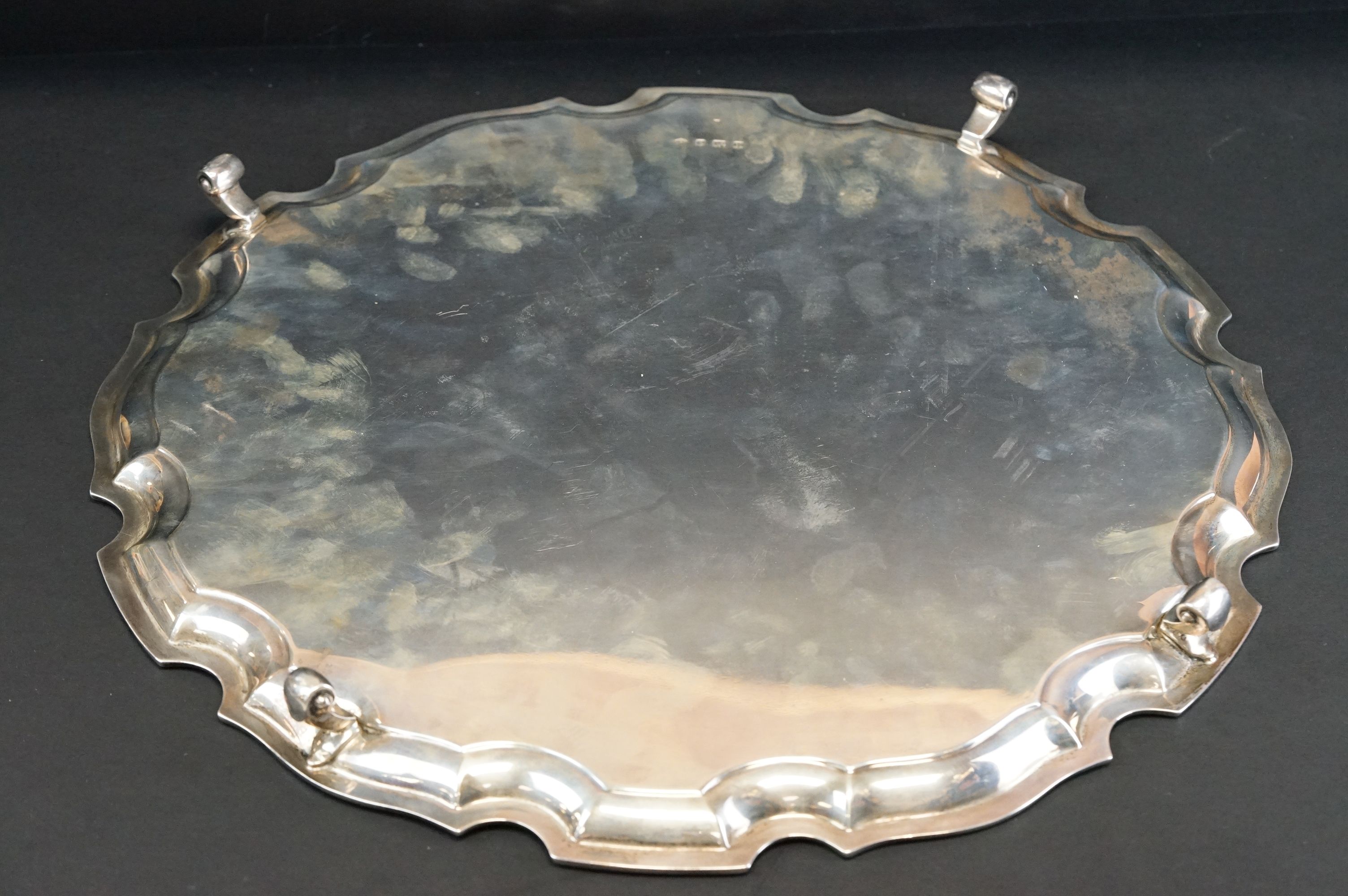 Silver salver raised on four scroll feet, plain polished, Chippendale style border, makers Adie - Image 3 of 11