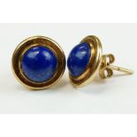 Pair of lapis lazuli 9ct yellow gold stud earrings, the circular cabochon cut lapis lazuli