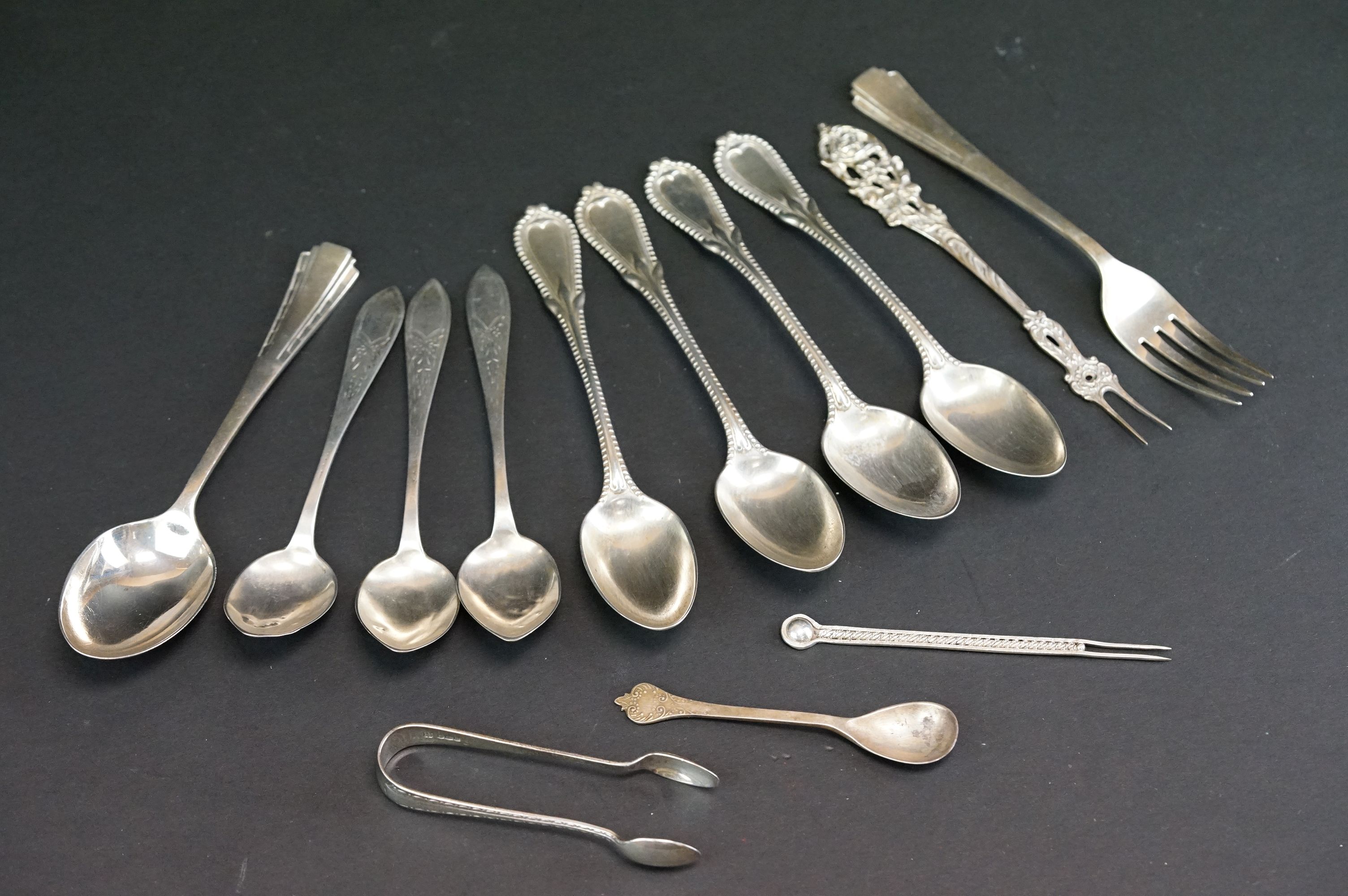 Collection of silver and white metal flatware to include a set of five white metal teaspoons with