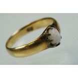 Early 20th century opal 18ct yellow gold ring, the oval cabochon cut precious white opal