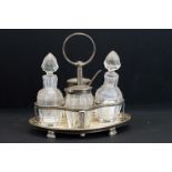 Early 20th Century four-piece silver and cut glass cruet set and stand by John Grinsell & Sons,