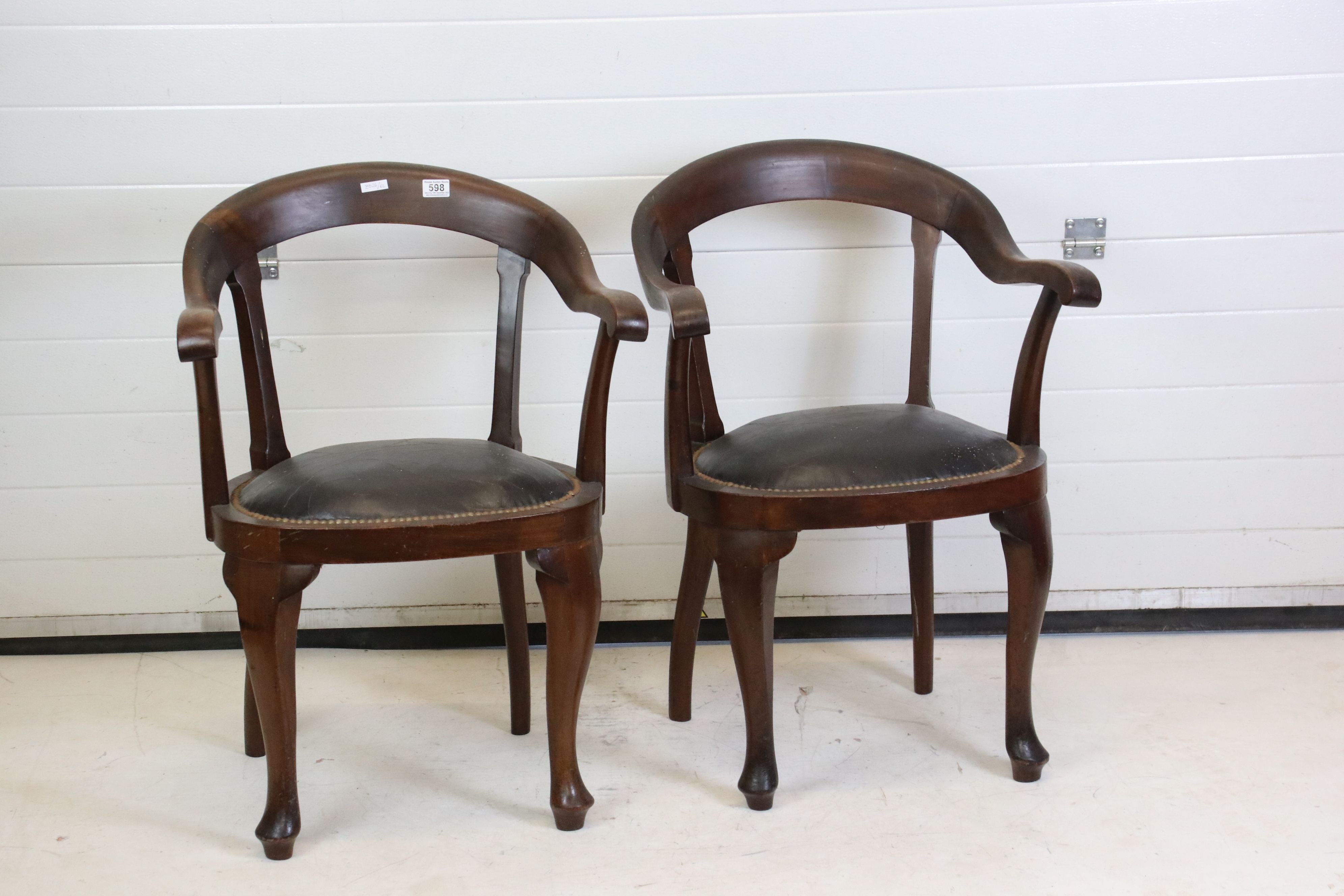 Pair of Victorian Mahogany Horseshoe shaped open Tub Chairs with padded black leather studded seats,