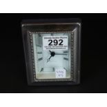 Silver framed desk clock by R Carr, clockmaker