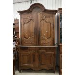 Large French Oak Armoire Cupboard, the upper section with shaped moulded cornice over two cupboard