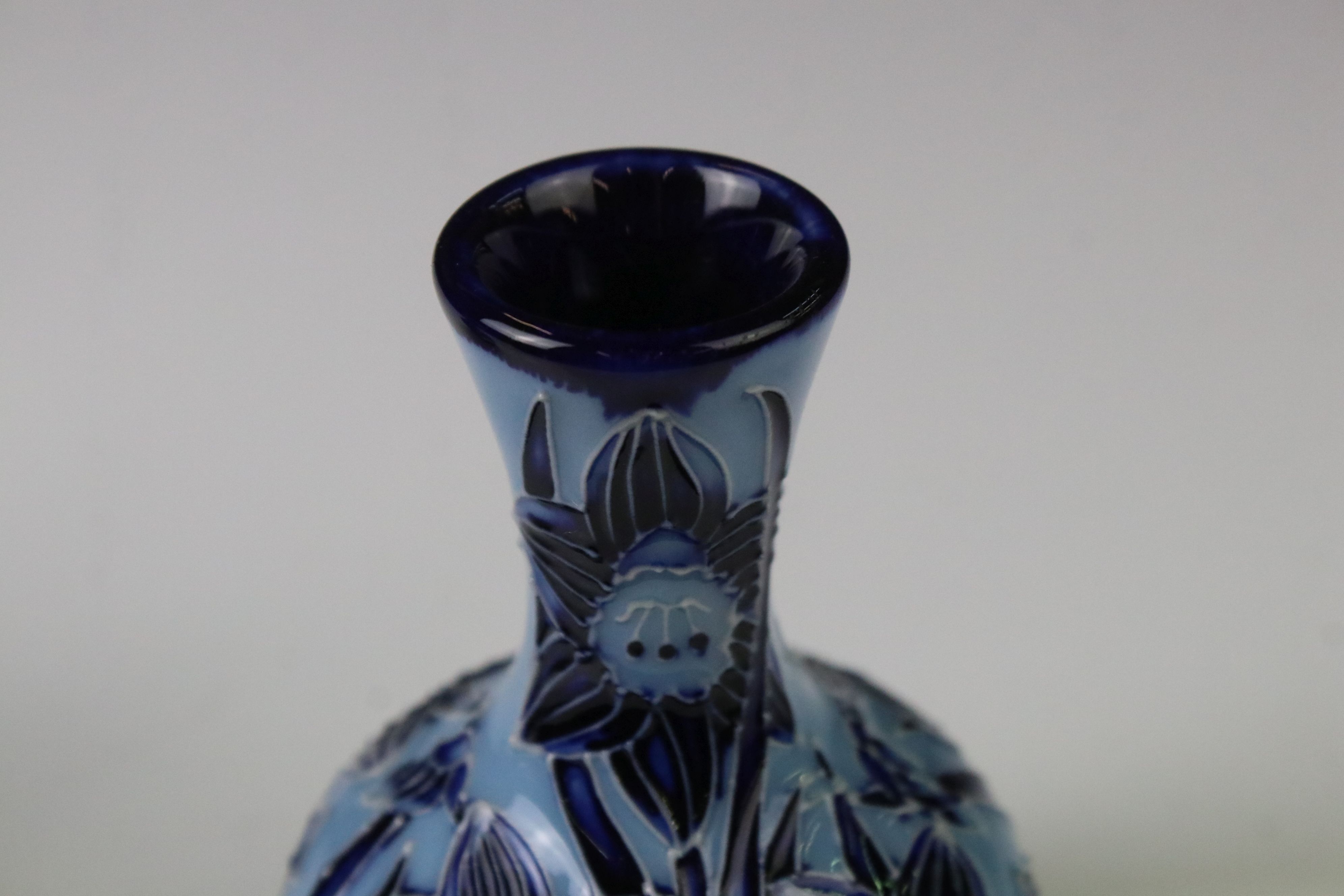 Two Moorcroft pottery vases of bulbous form to include a Violets pattern example on blue ground, - Image 7 of 8